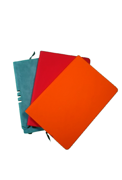 Colorful A5 PU leather notebook set with red, orange, and teal covers, featuring lined pages and ribbon bookmarks.